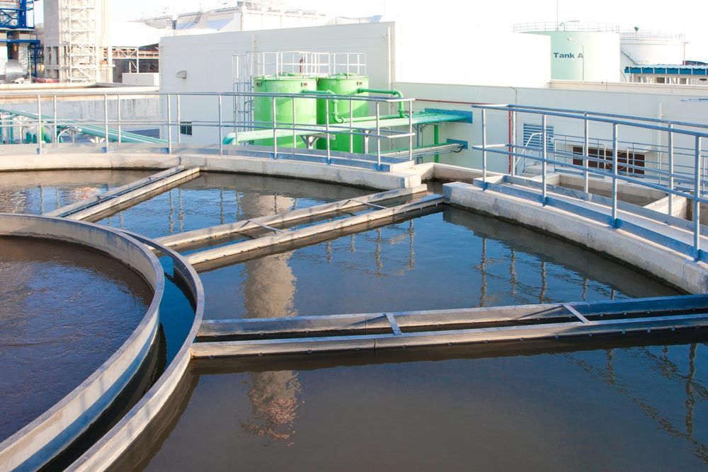 Water Treatment Tanks With Clear Water in an Industrial Setting — Keyeng in Slade Point, QLD