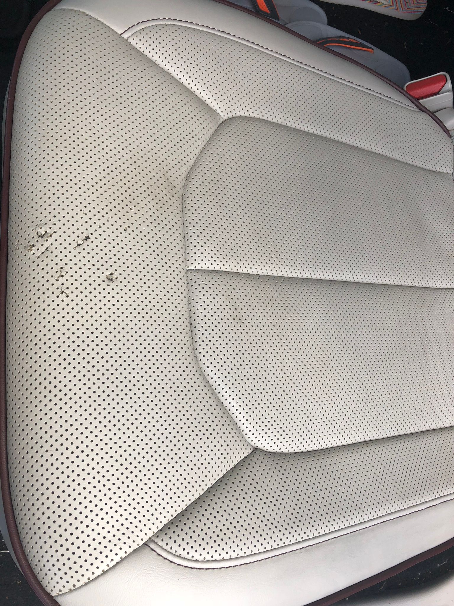 Perforated Leather seat damage. Holes, Split, Ripped, Cut
