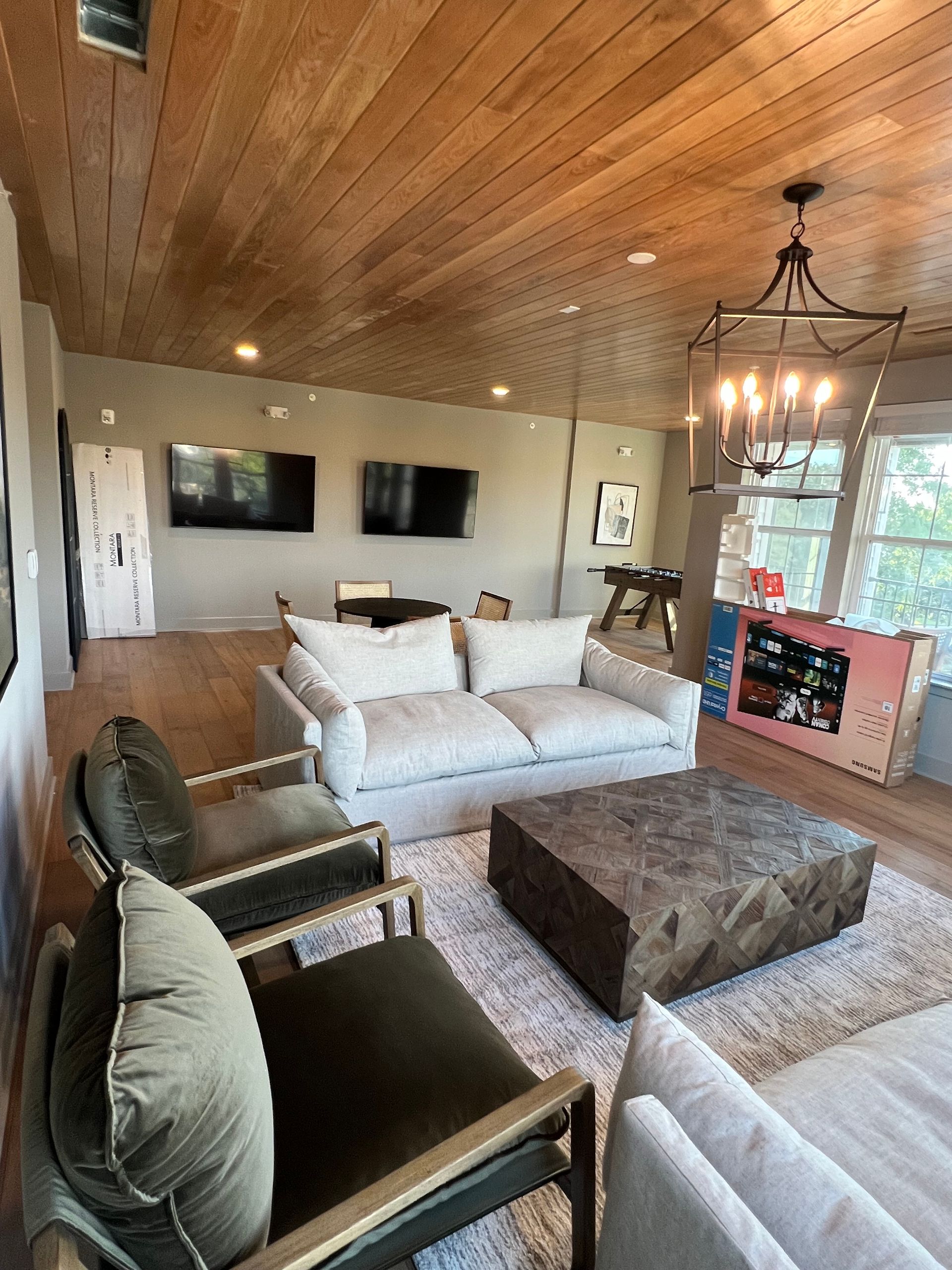 A living room with a couch , chairs and a coffee table