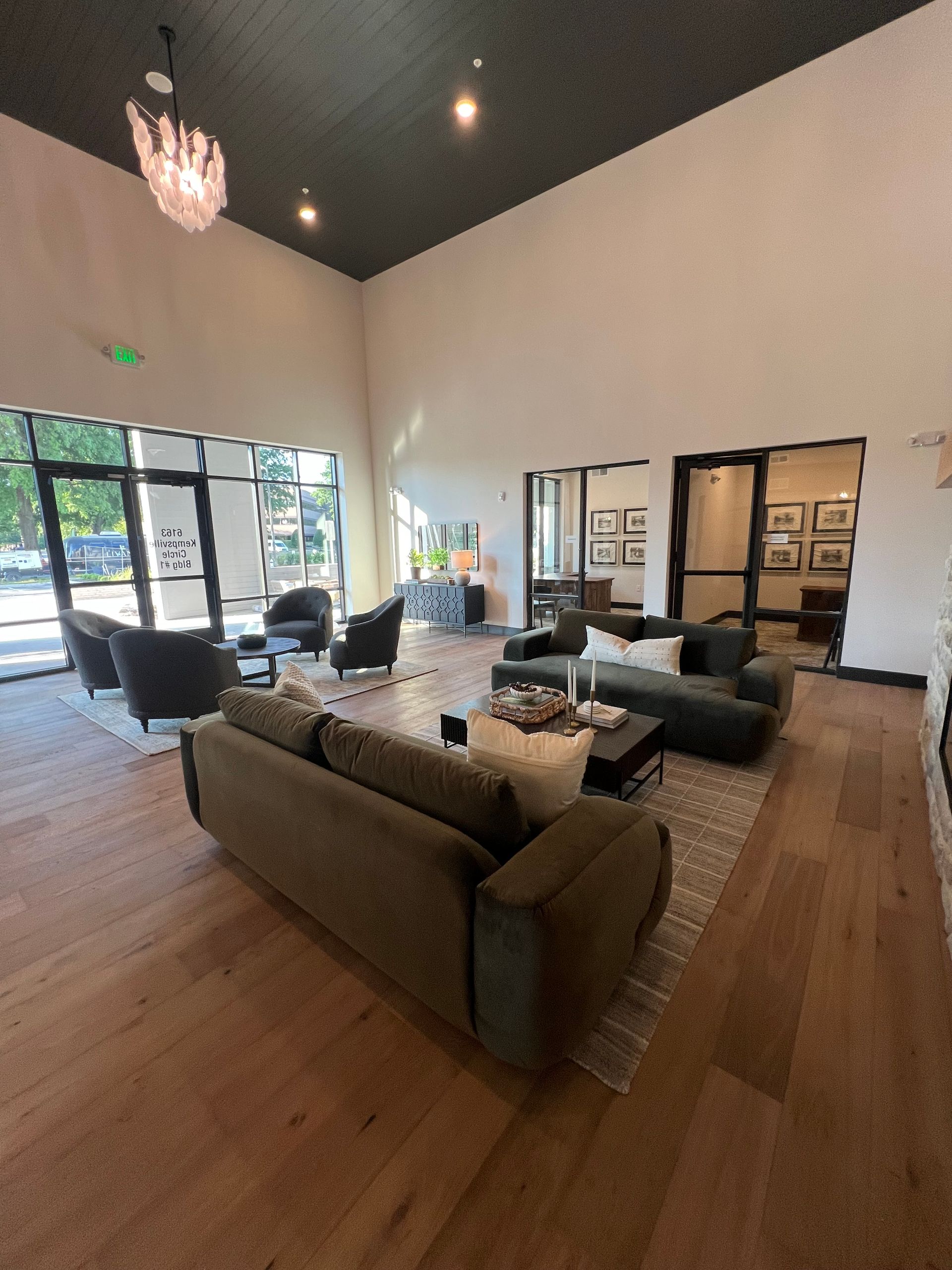 A living room with a couch and chairs in it