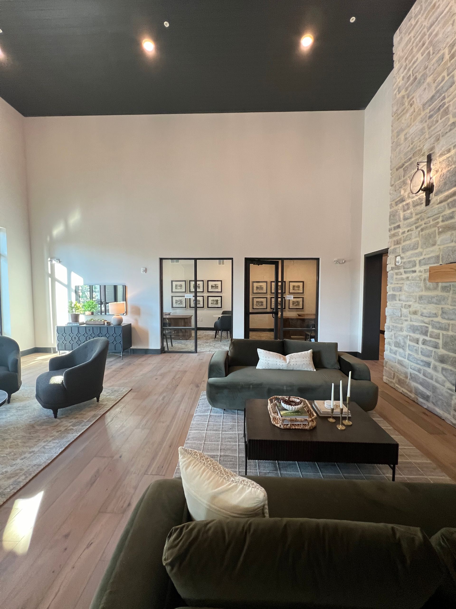 A living room with a couch , chairs and a coffee table