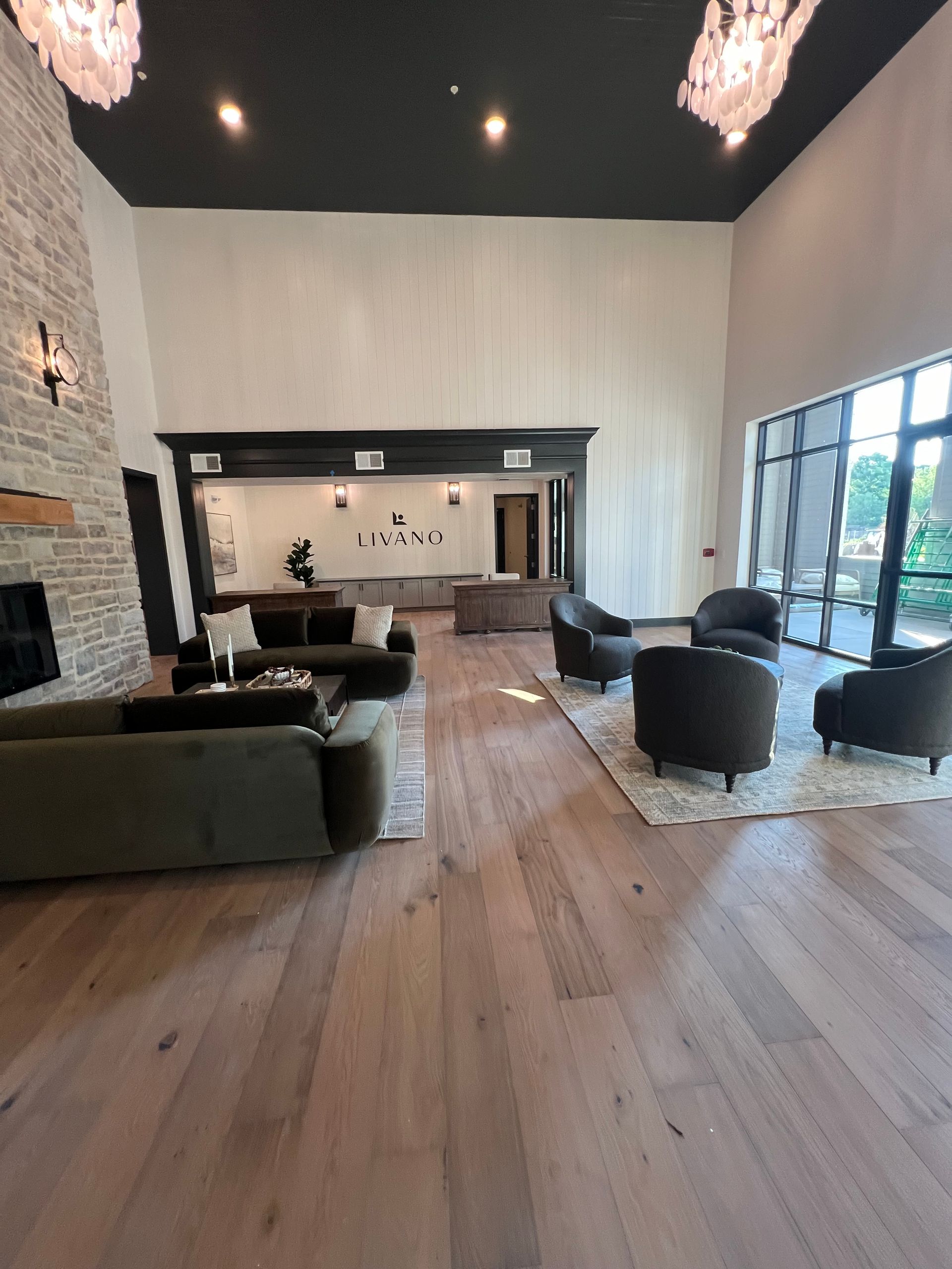 A living room with a lot of furniture and a fireplace