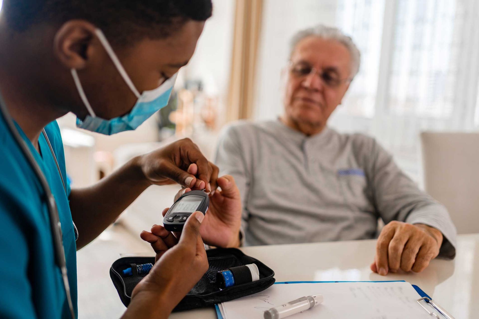 A doctor checking for blood sugar.