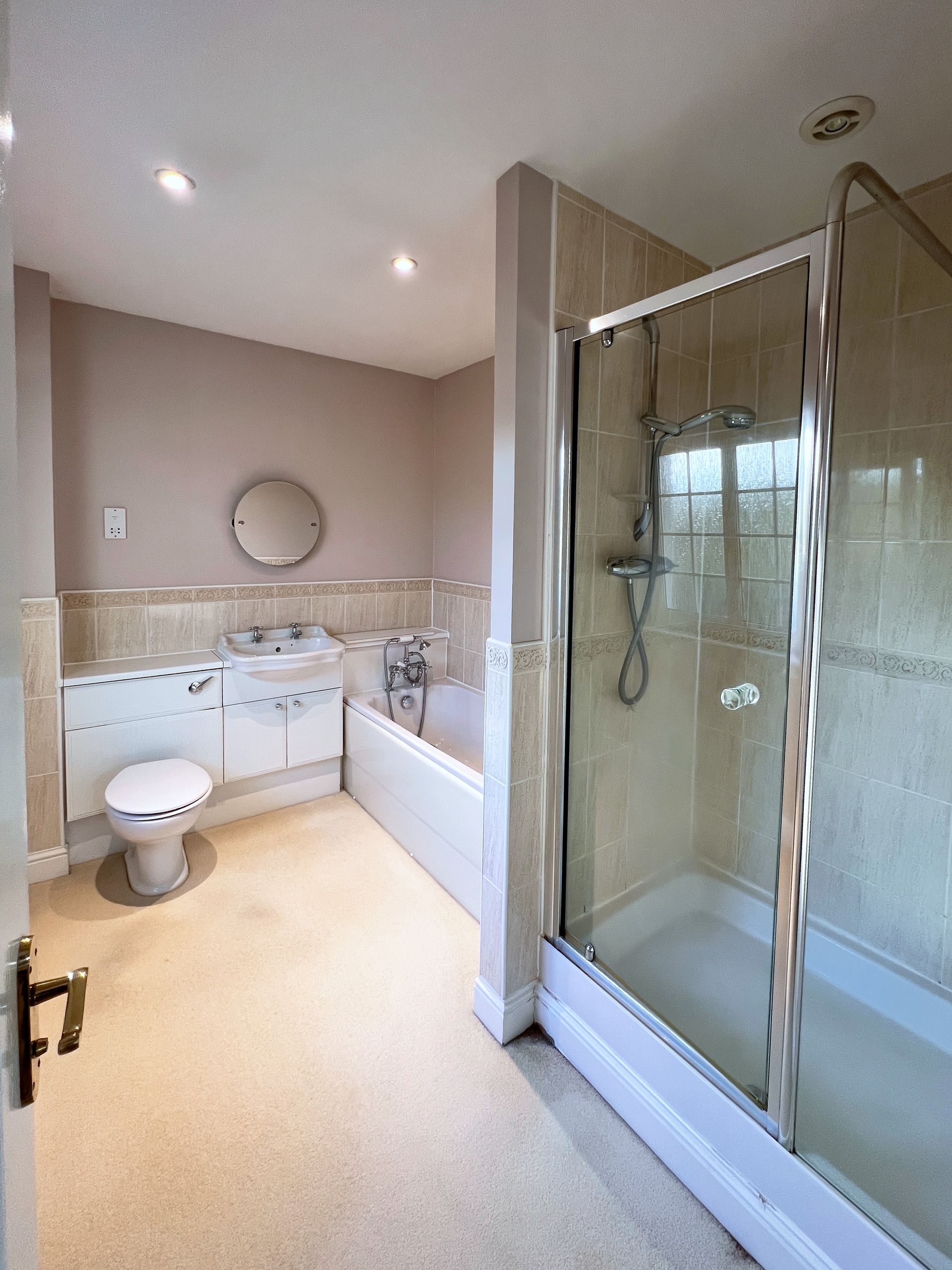 An old bathroom with a sink , a toilette and a bath.