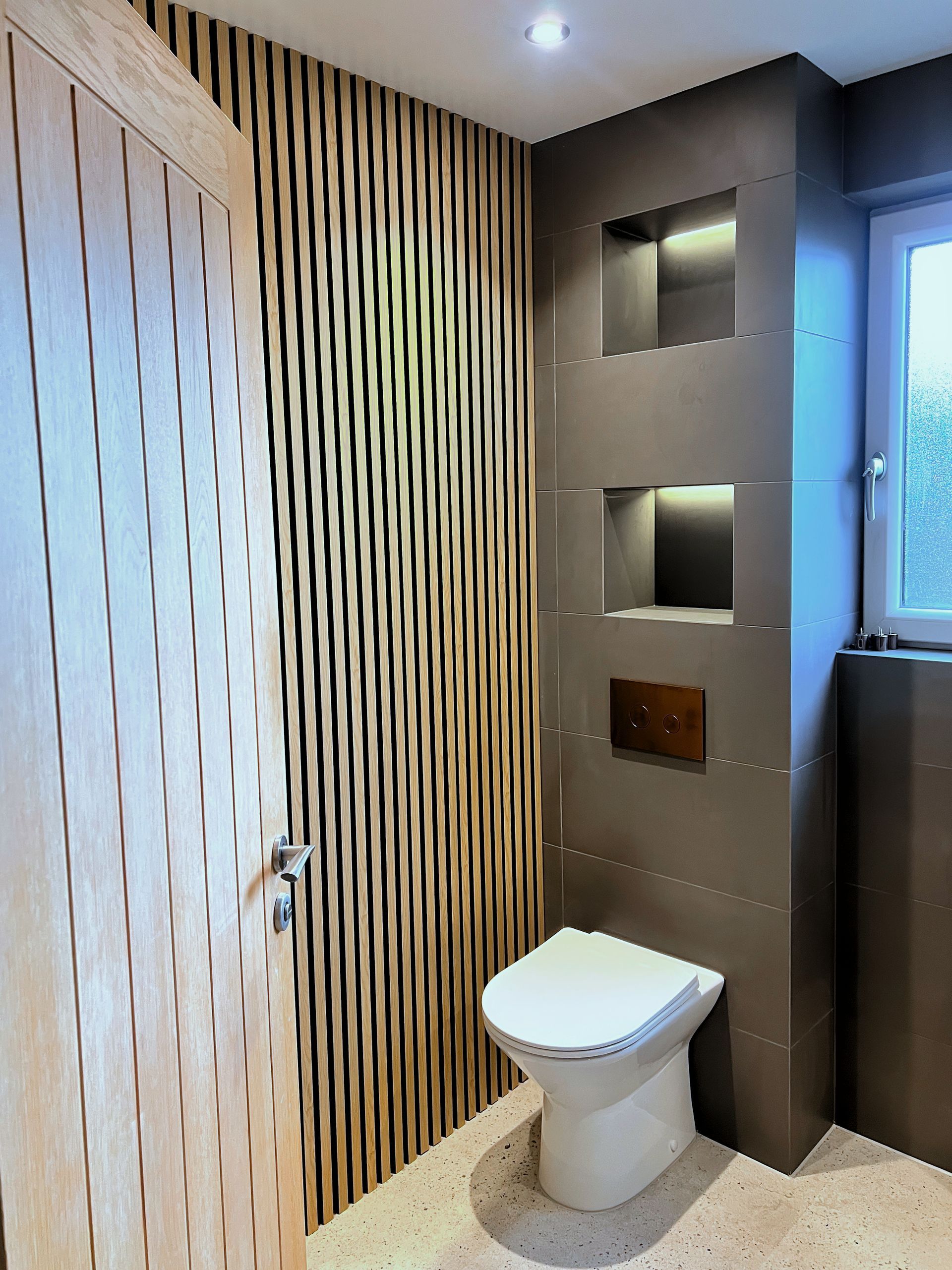 A bathroom with a toilet a sink and a bathtub