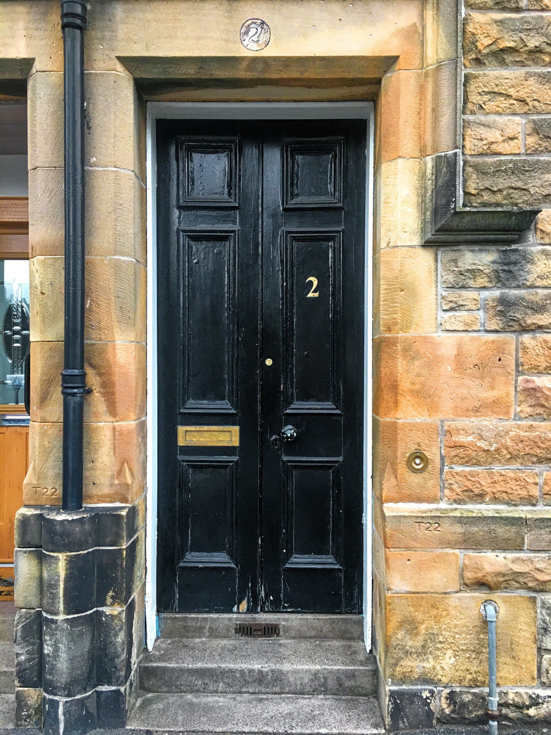 A black door with the number 2 on it