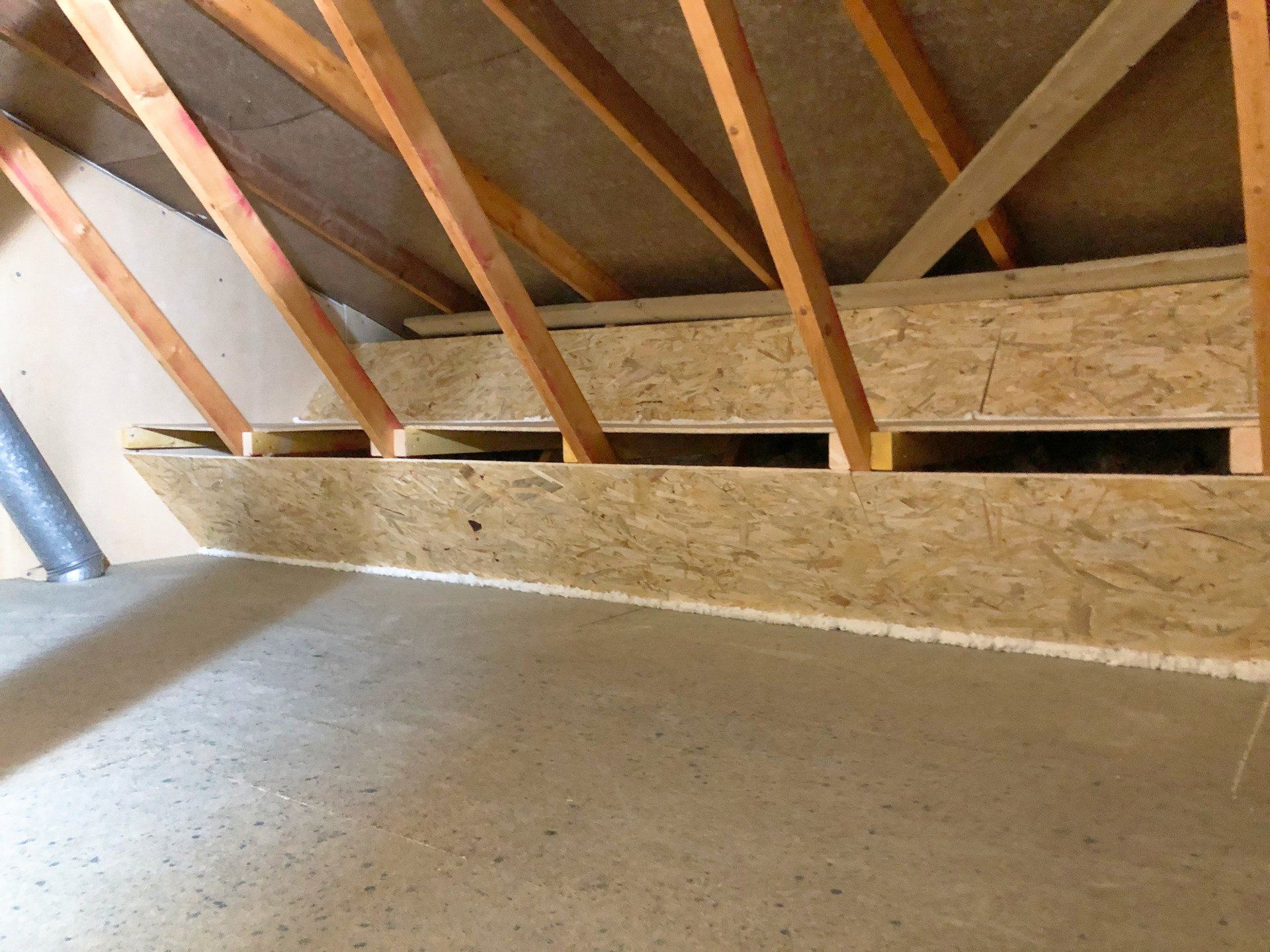 A wooden floor int he attic.