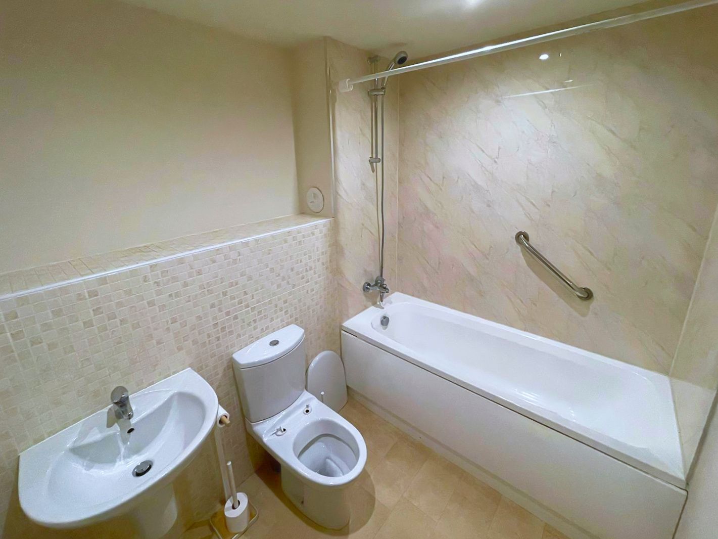 An old bathroom with a sink , a toilette and a bath.