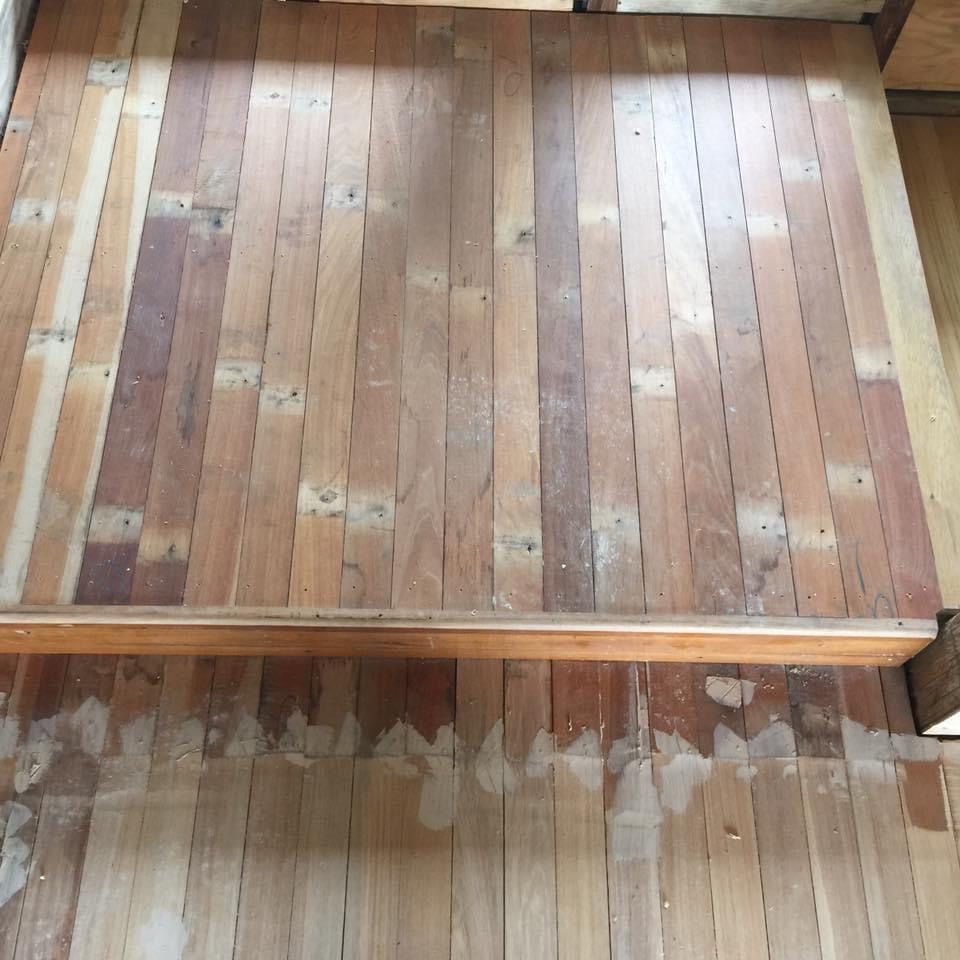 A Close Up of Wooden Floor Boards Repaired With Putty  — Byron Floor Sanding In Yamba, NSW