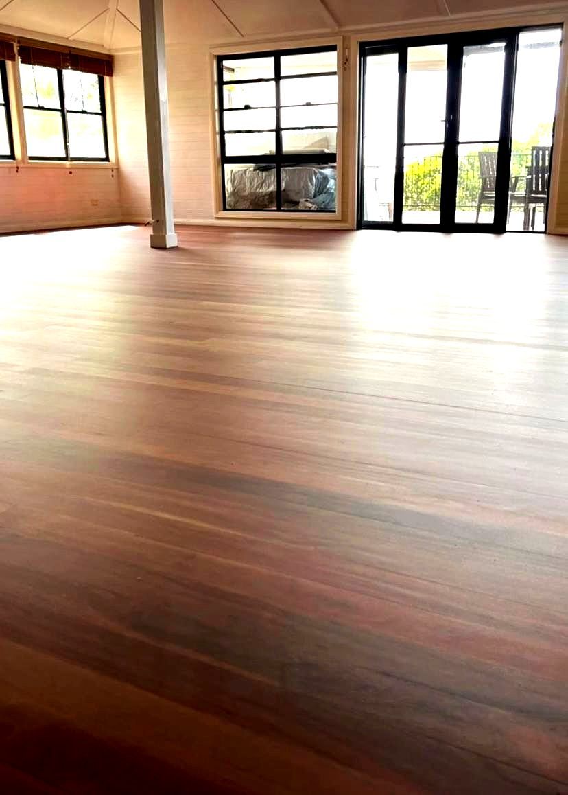 A Room A Wooden Floor And A Pole and Windows— Byron Floor Sanding In Yamba, NSW