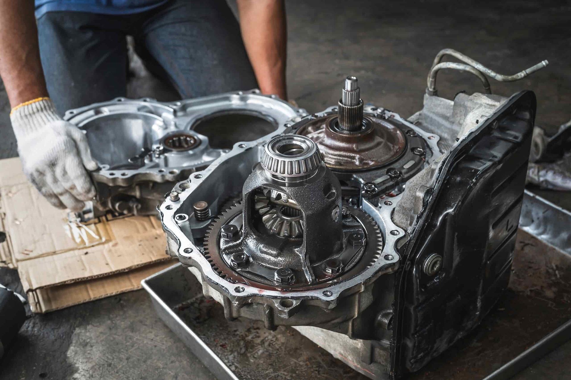 A Man is Working on a Car Engine in a Garage — Steve's Service Centre in Albury, NSW
