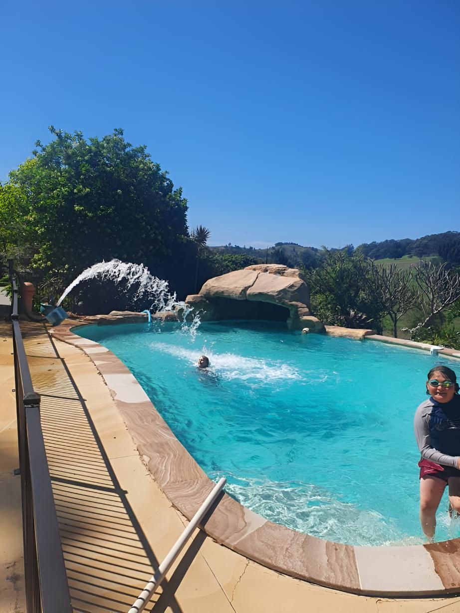 Kid is Enjoying Swimming Pool — Gary Arnold Water Supplies in Tweed Coast, NSW