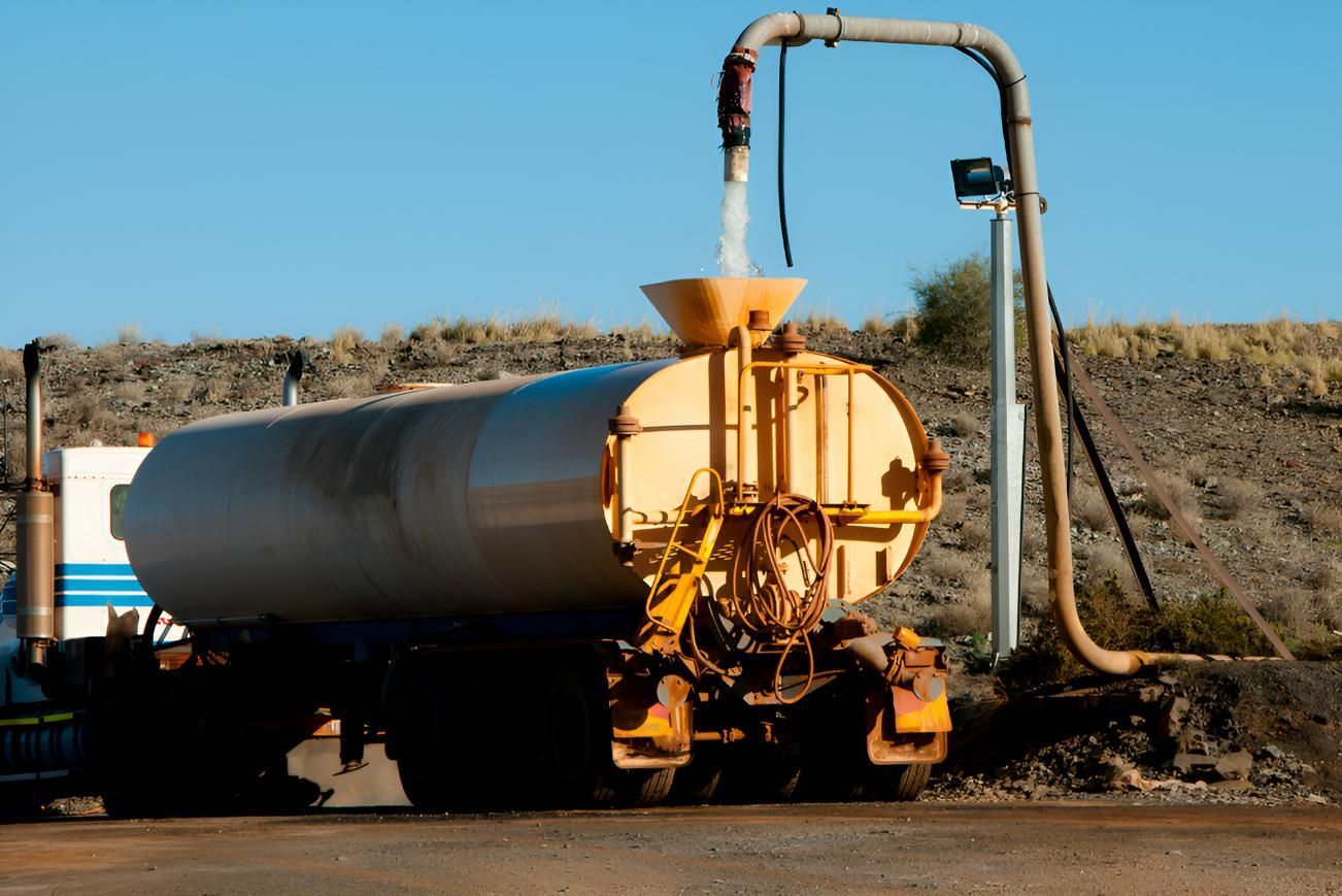Tanker Truck is Being Filled With Water From a Hose — Gary Arnold Water Supplies in Tweed Coast, NSW
