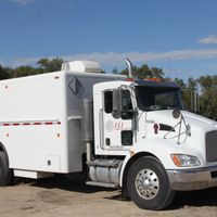 A white truck with the word ELI on the door