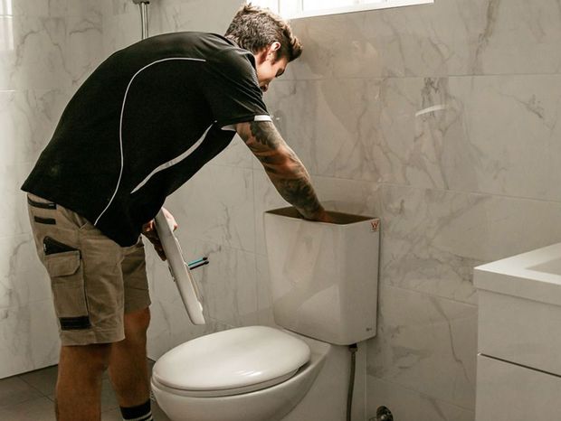 Plumber Using Plunger - Plumbing Services in Nelson Bay, NSW