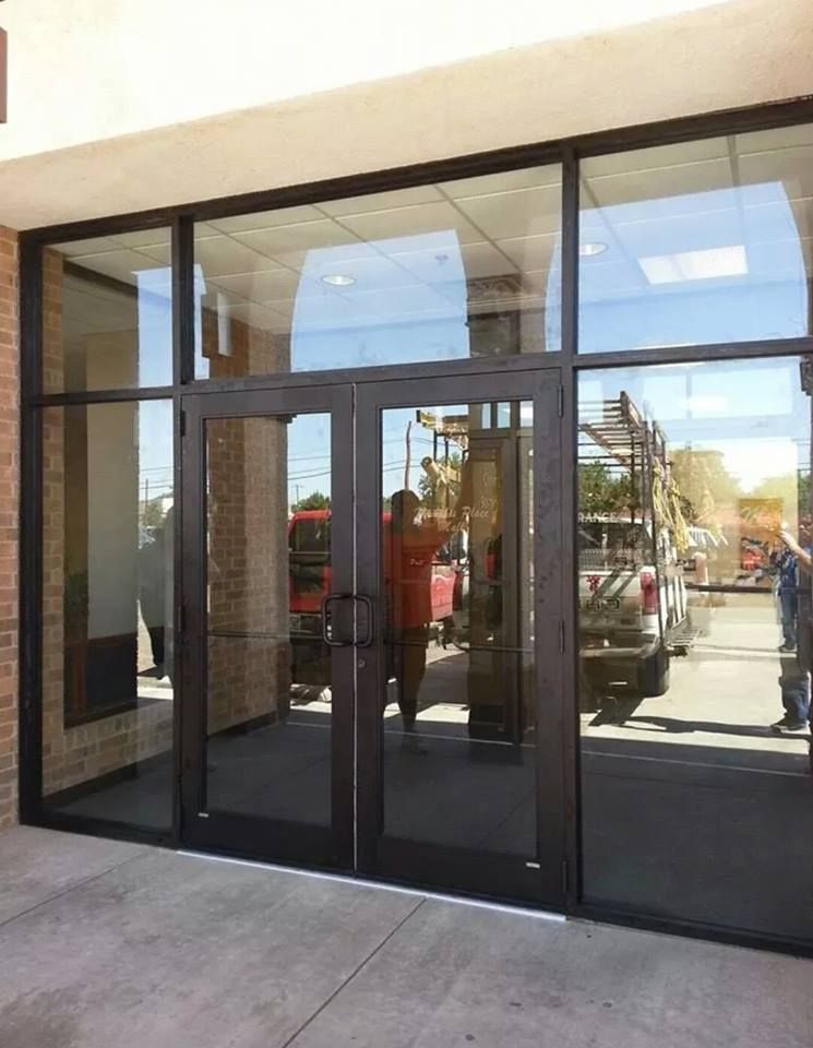 A store front with a lot of glass doors