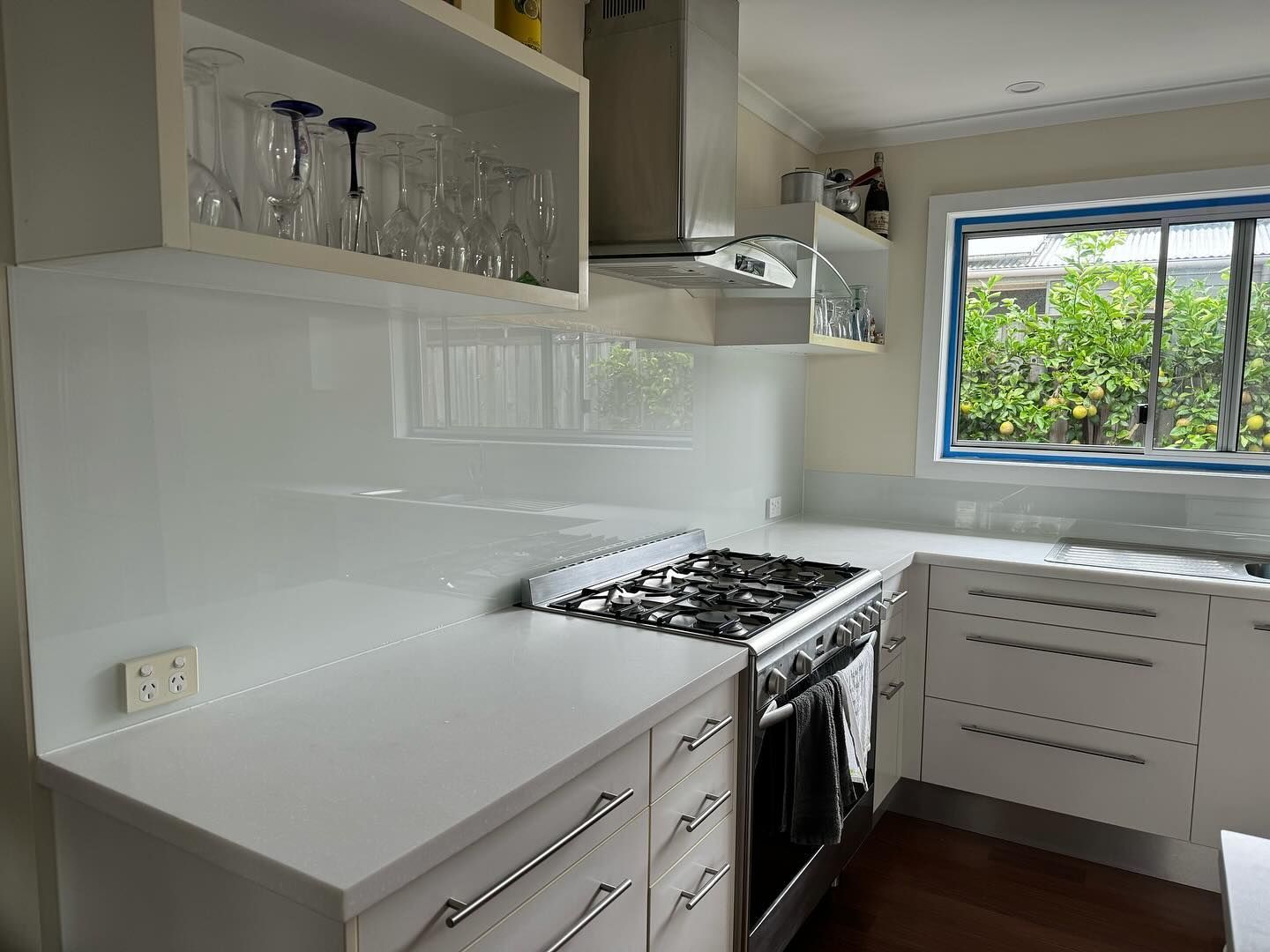 Clean Kitchen With Cabinets and Stove — SC Glass & Aluminium in Yandina, QLD