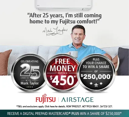 A Man is Sitting on a Couch in Front of a Fujitsu Air Conditioner — Atmosphere Air Conditioning & Refrigeration In Taylors Beach, NSW