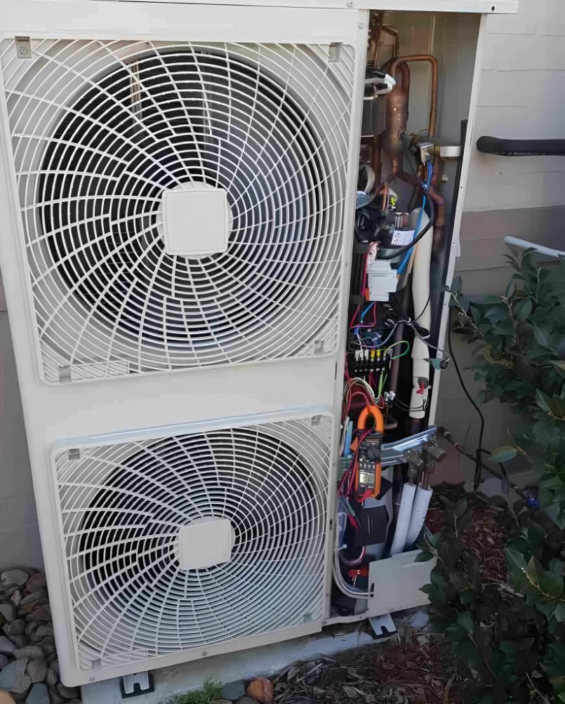 A White Air Conditioner With the Cover Open — Atmosphere Air Conditioning & Refrigeration In Taylors Beach, NSW