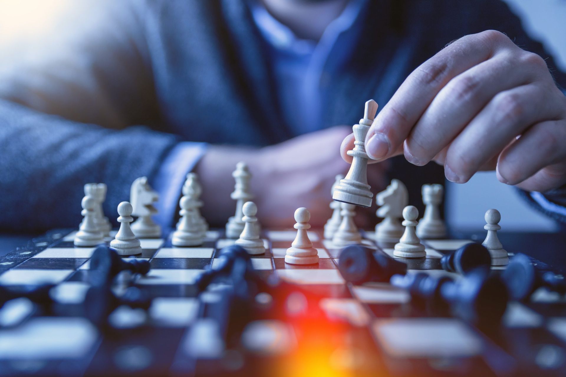 chess board with player making calculated move