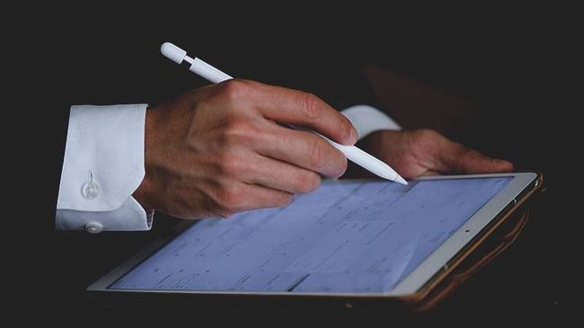 Attorney with pen reviewing document 
