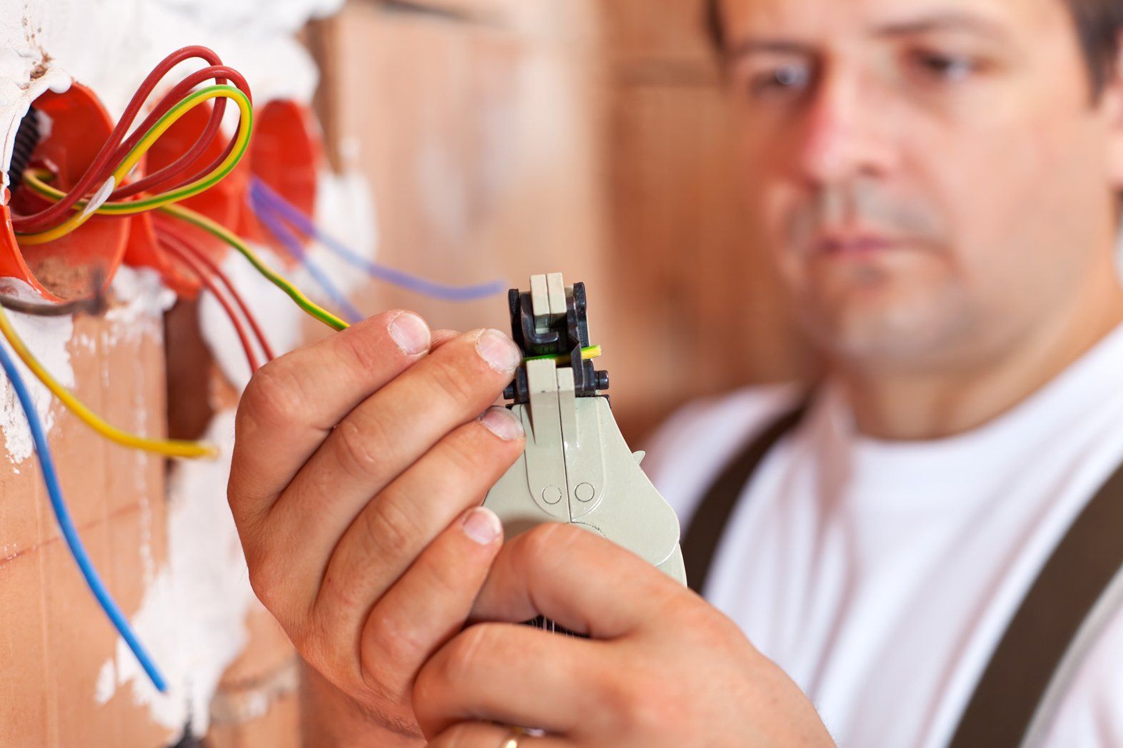 Electrician installing electric wires
