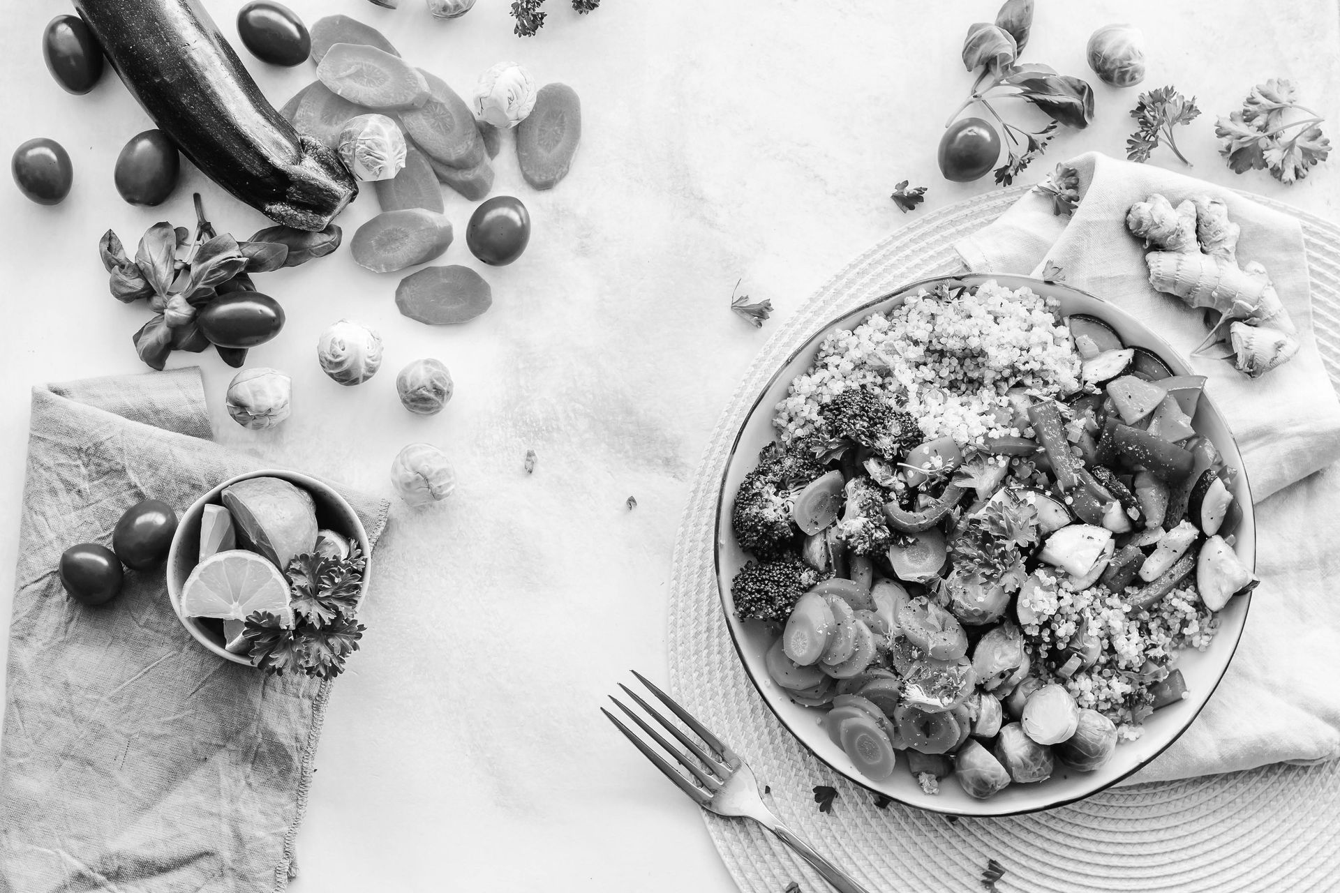 A black and white photo of a plate of food on a table.