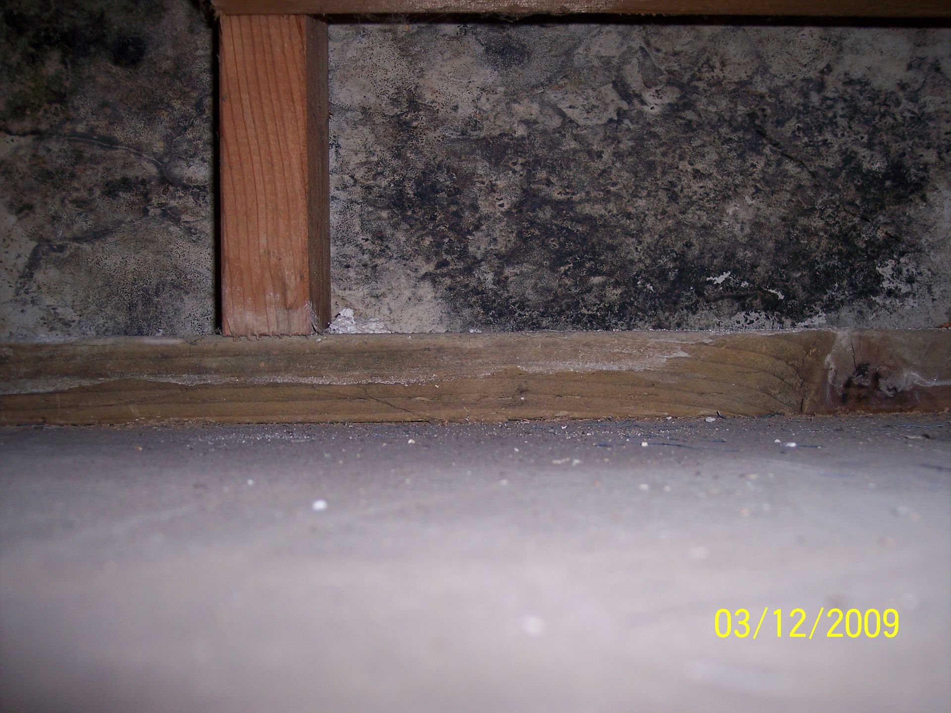 A picture of a concrete wall with a wooden frame taken on 03/12/2009