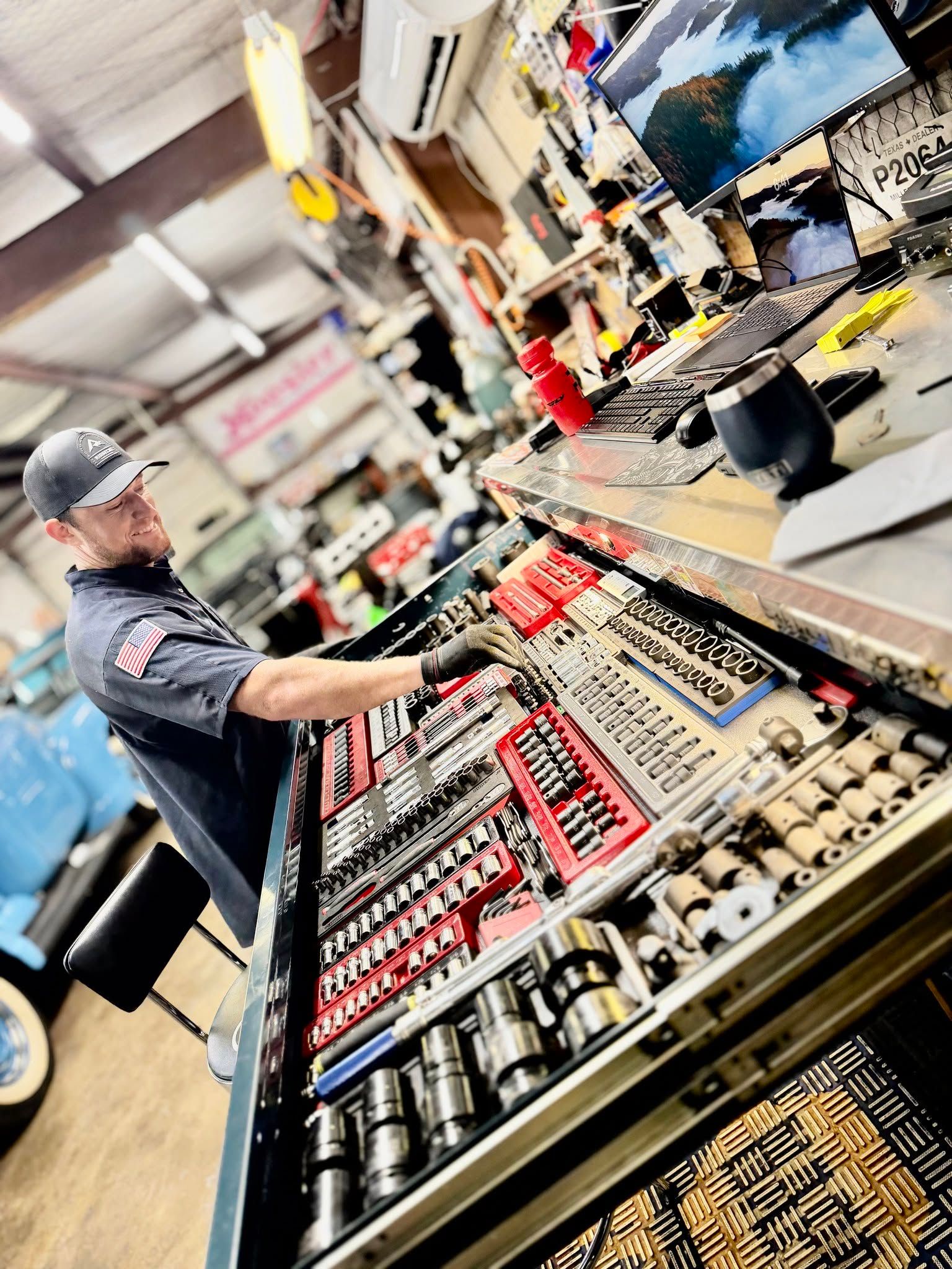 Worker arranging merchandise on a store display counter in a retail shop