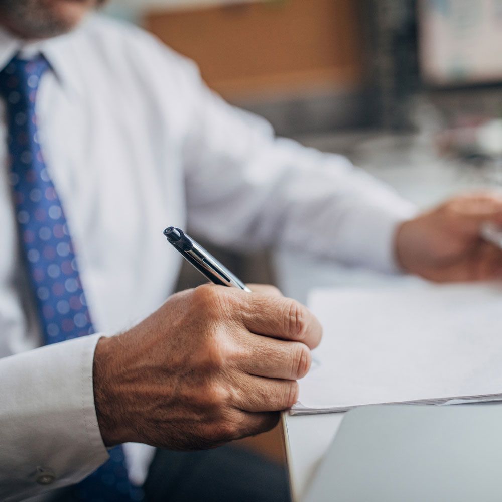 Lawyer Writing on Paper — Grand Forks, ND — Labine Law Firm