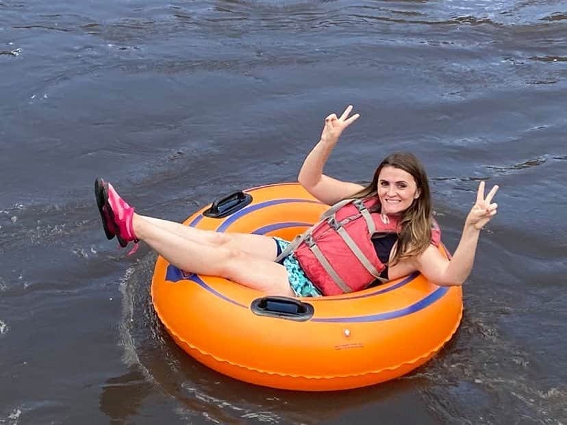 Cute girl floating down the river