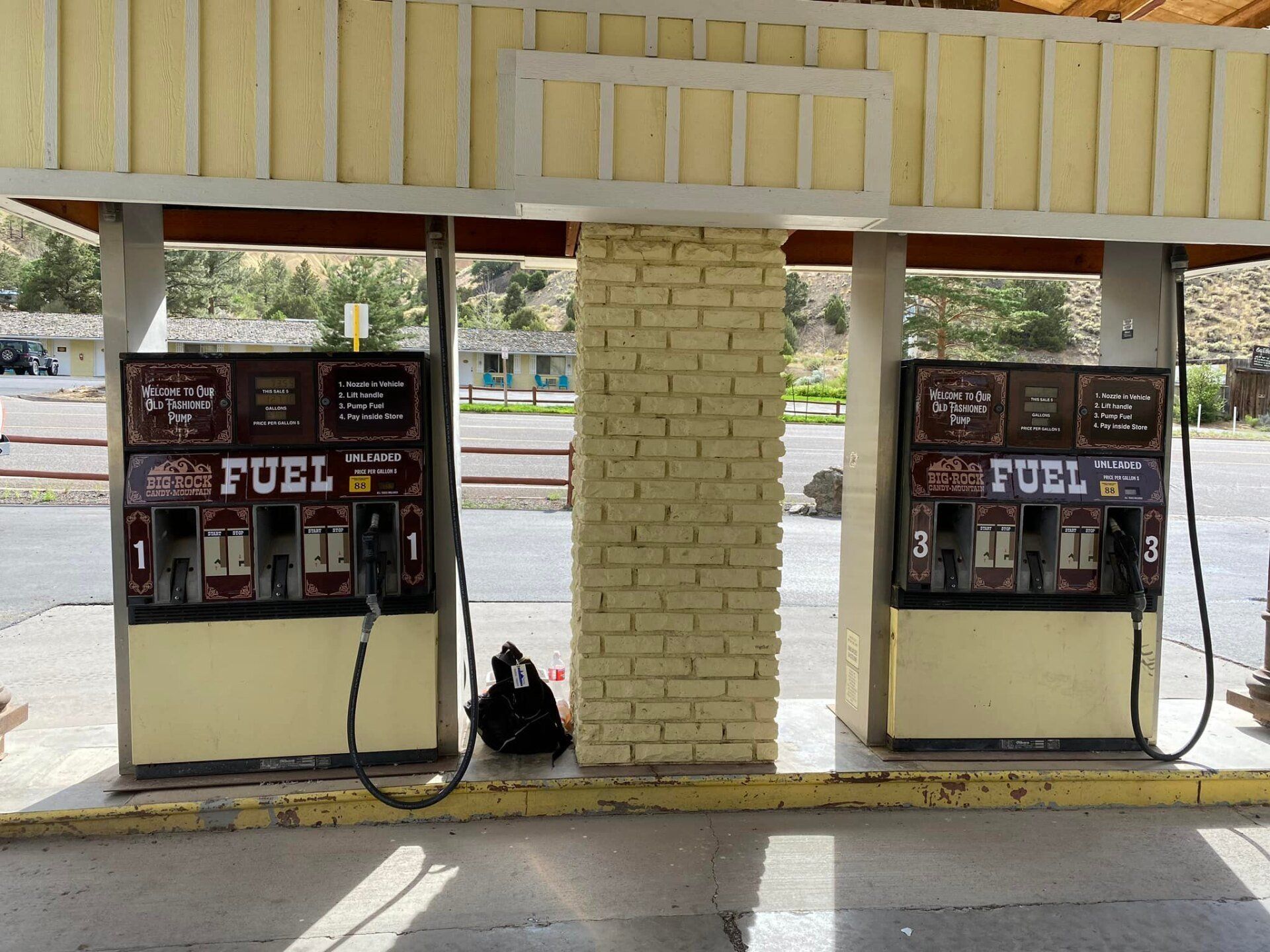 Two gas pumps with the word fuel on them