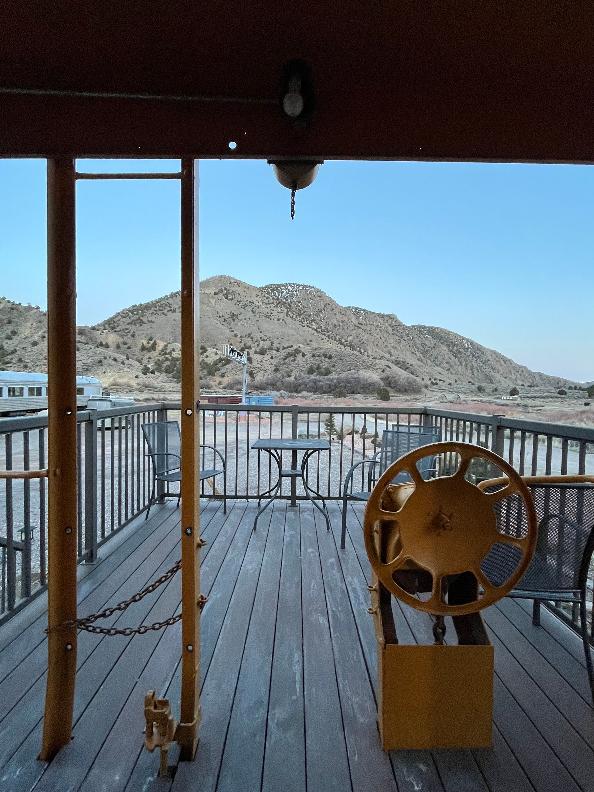 A wooden deck with a steering wheel on it