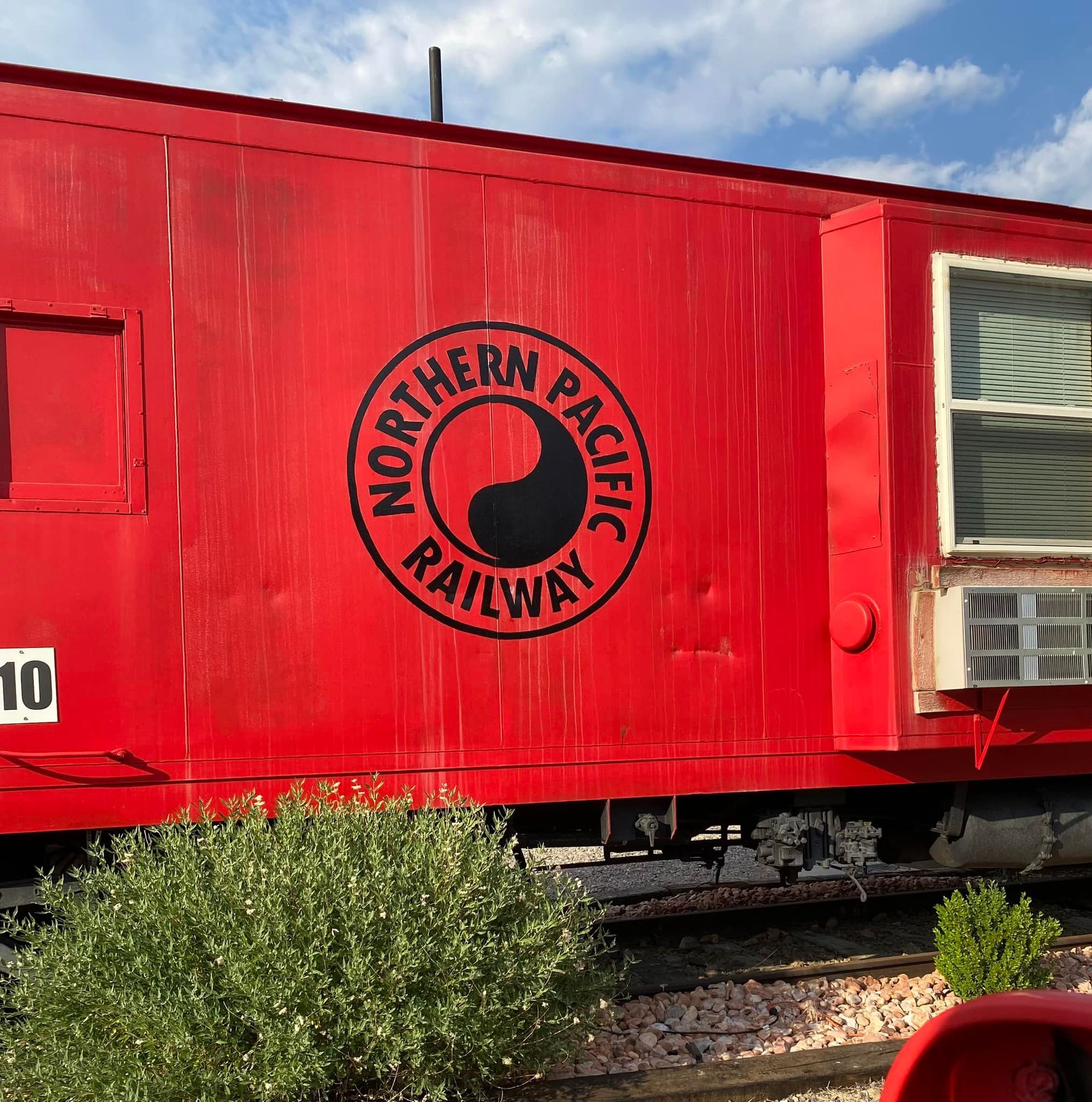 A red northern pacific railway train car