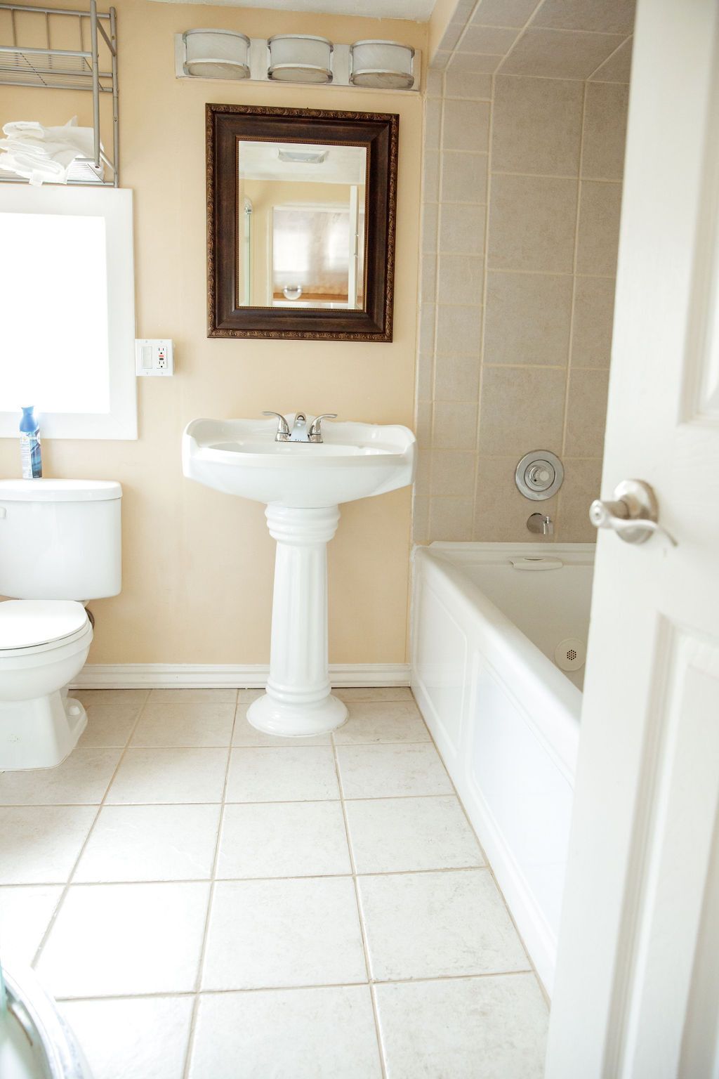 A bathroom with a toilet a sink and a bathtub