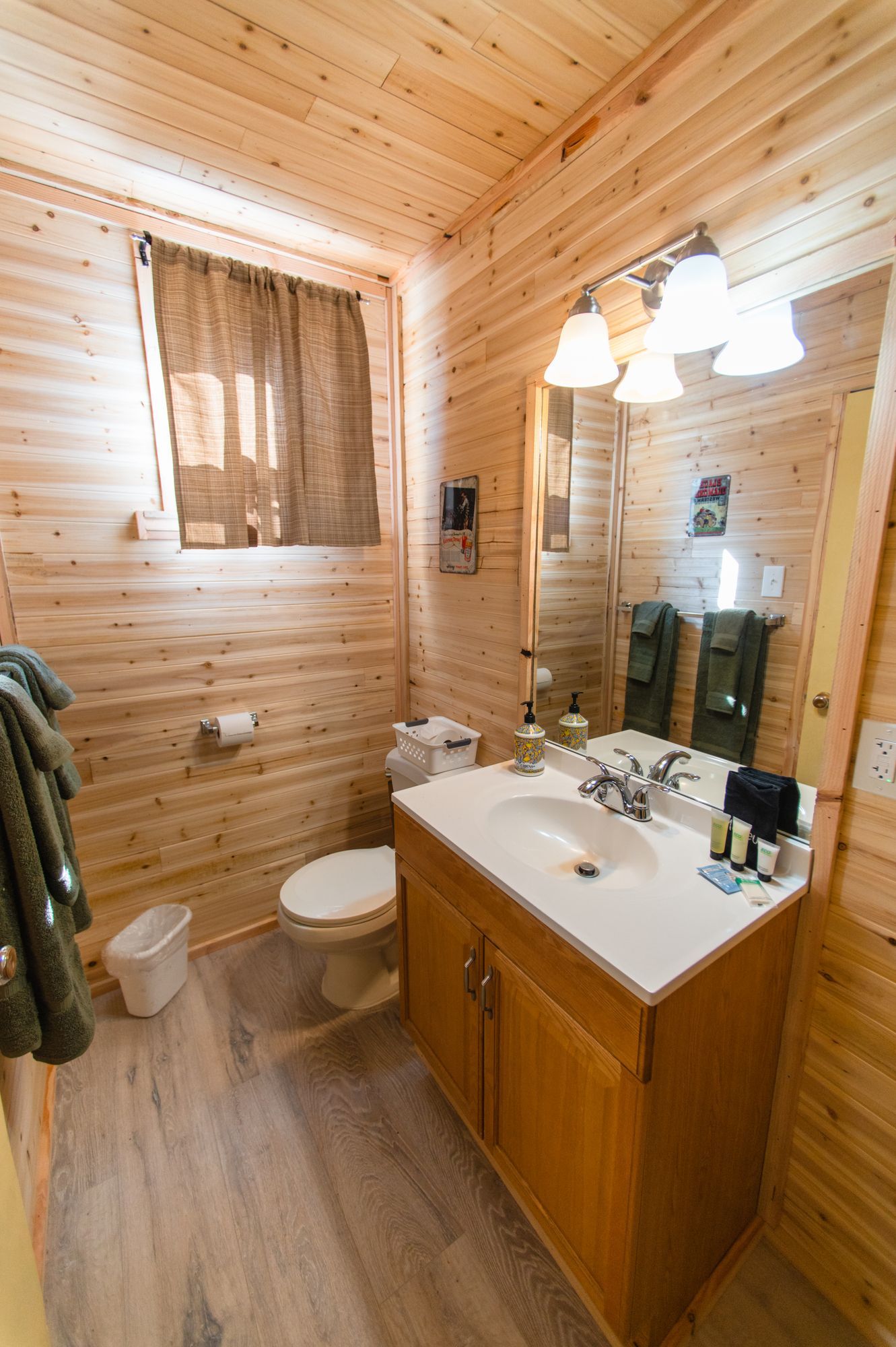 A bathroom with a sink , toilet , and mirror.