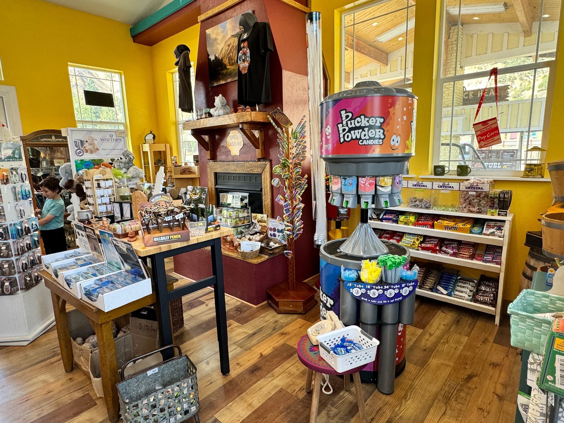 A store filled with lots of candy and a vending machine.