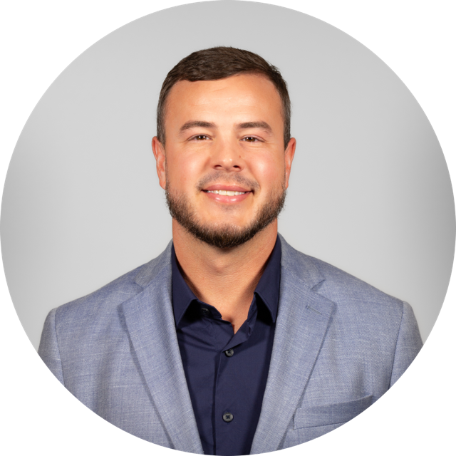 Mid-Missouri Real Estate Agent Josh Conyer in a Gray Suit Jacket. List Your Mid-Mo Home With Us!