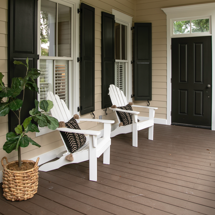 A Welcoming Porch With Two White Adirondack Chairs. Find Your New Home for Sale in Mid-Missouri.