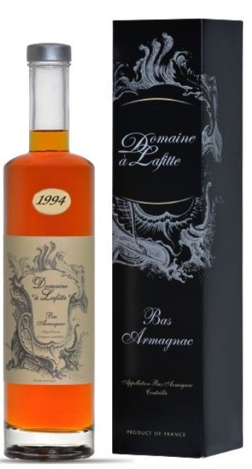 Bottiglia di Domaine de Lafitte Bas Armagnac 1994, accanto alla sua scatola nera con decori in argento.