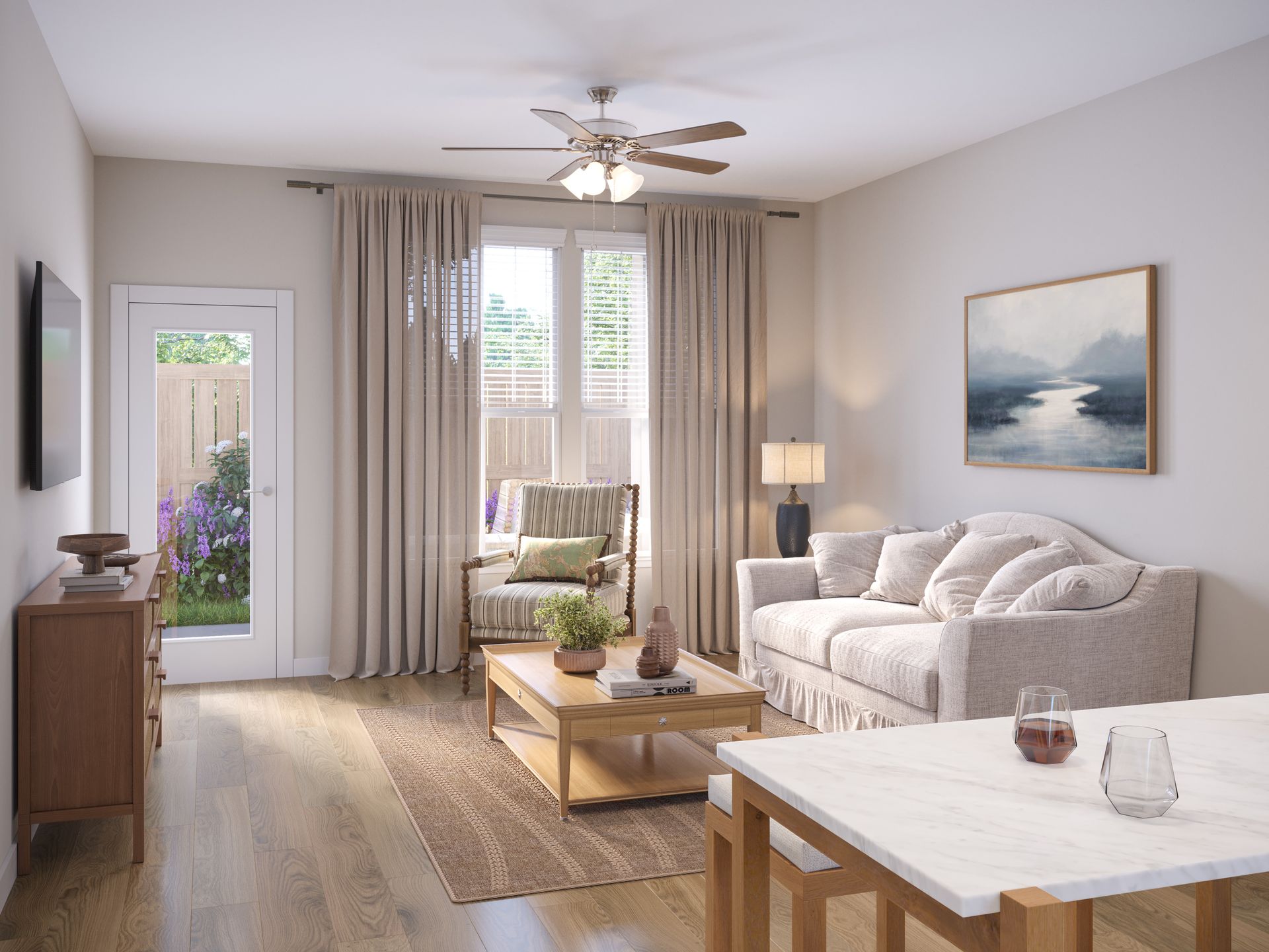A bright, modern living room features a beige sofa, a coffee table, an armchair by a window, and a dining table in front.