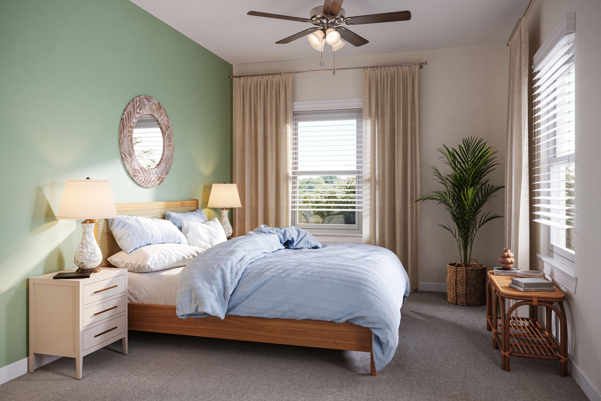 A bedroom with a sage green accent wall, wooden bed frame, light blue bedding, and a large potted plant by the window.