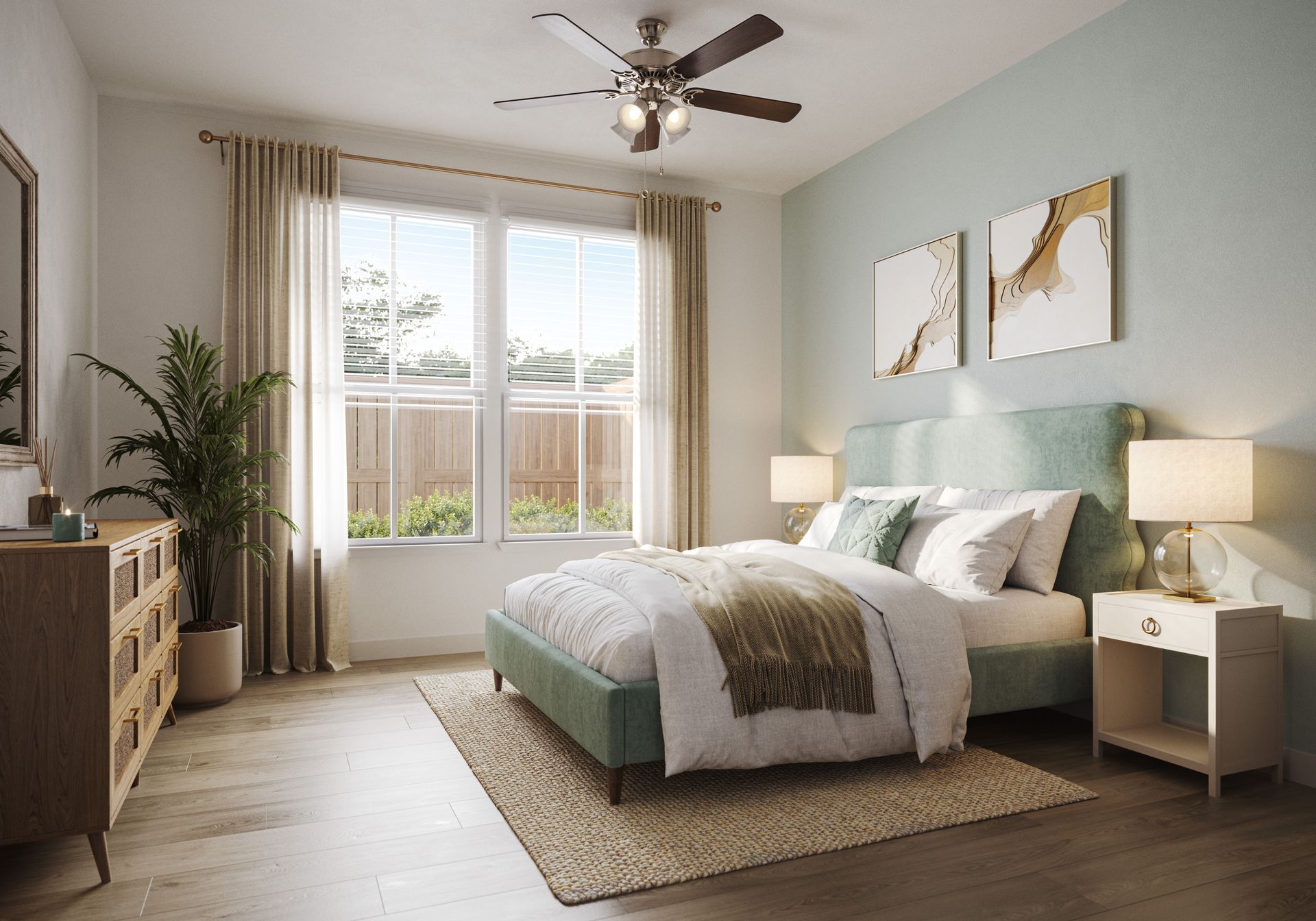 A sunlit bedroom features a teal upholstered bed, matching wall paint, a ceiling fan, a textured rug, and wooden furniture.