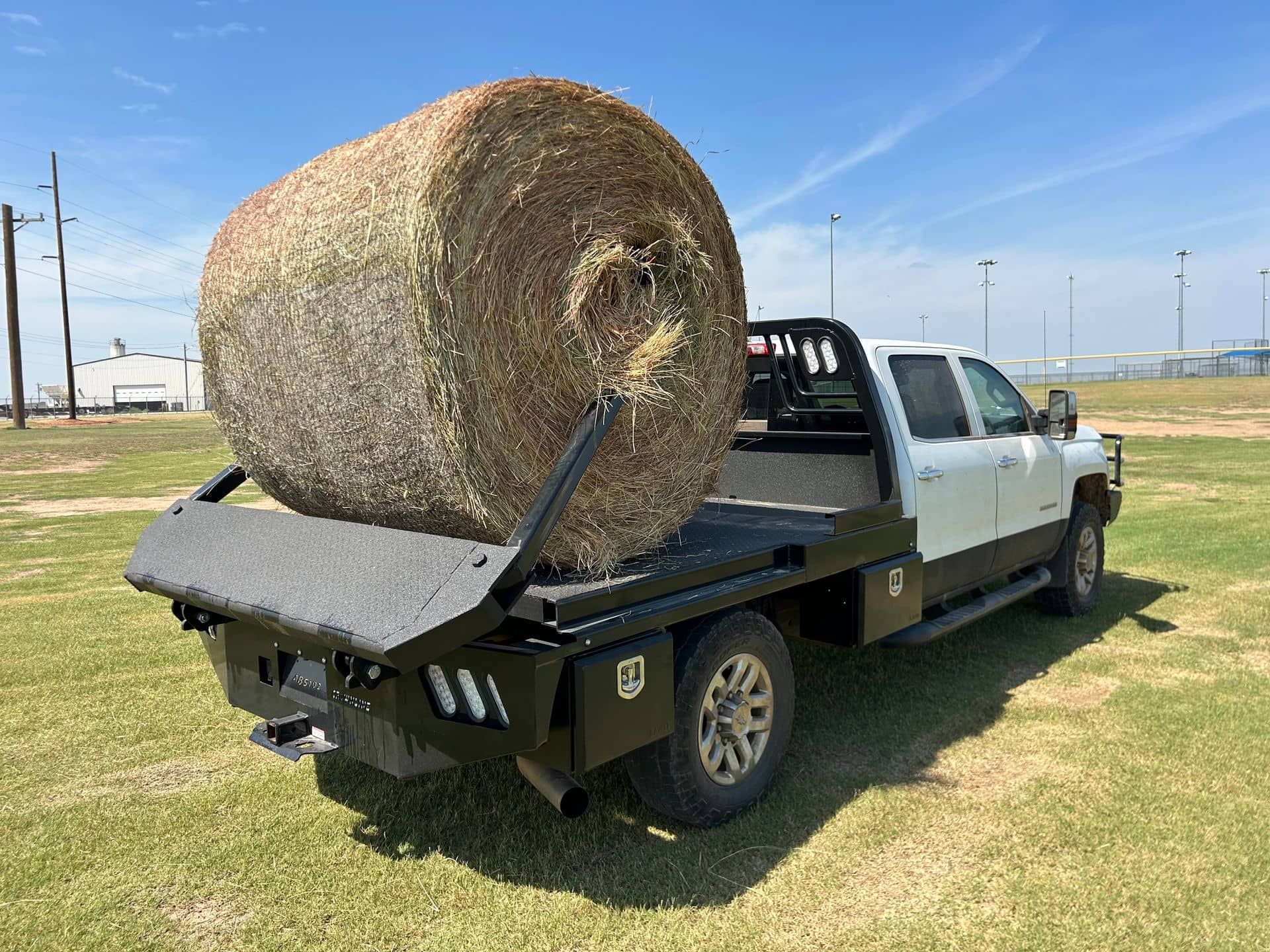 Crownline arm bed with hay bale being lifted