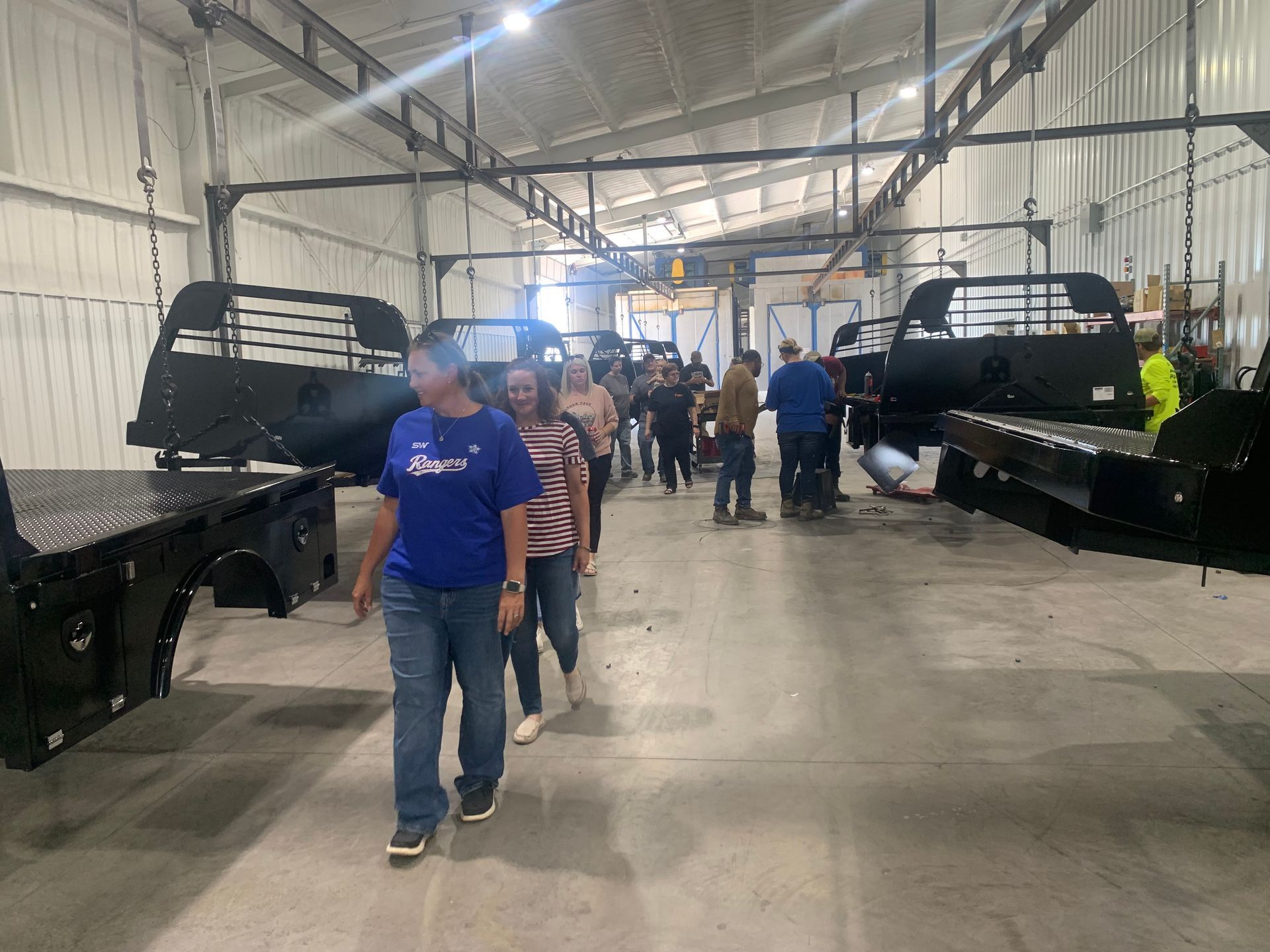 image of people walking through truck bed factory