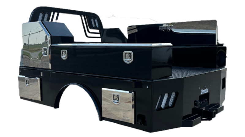 Black truck bed with toolboxes, chrome accents, and a head rack.