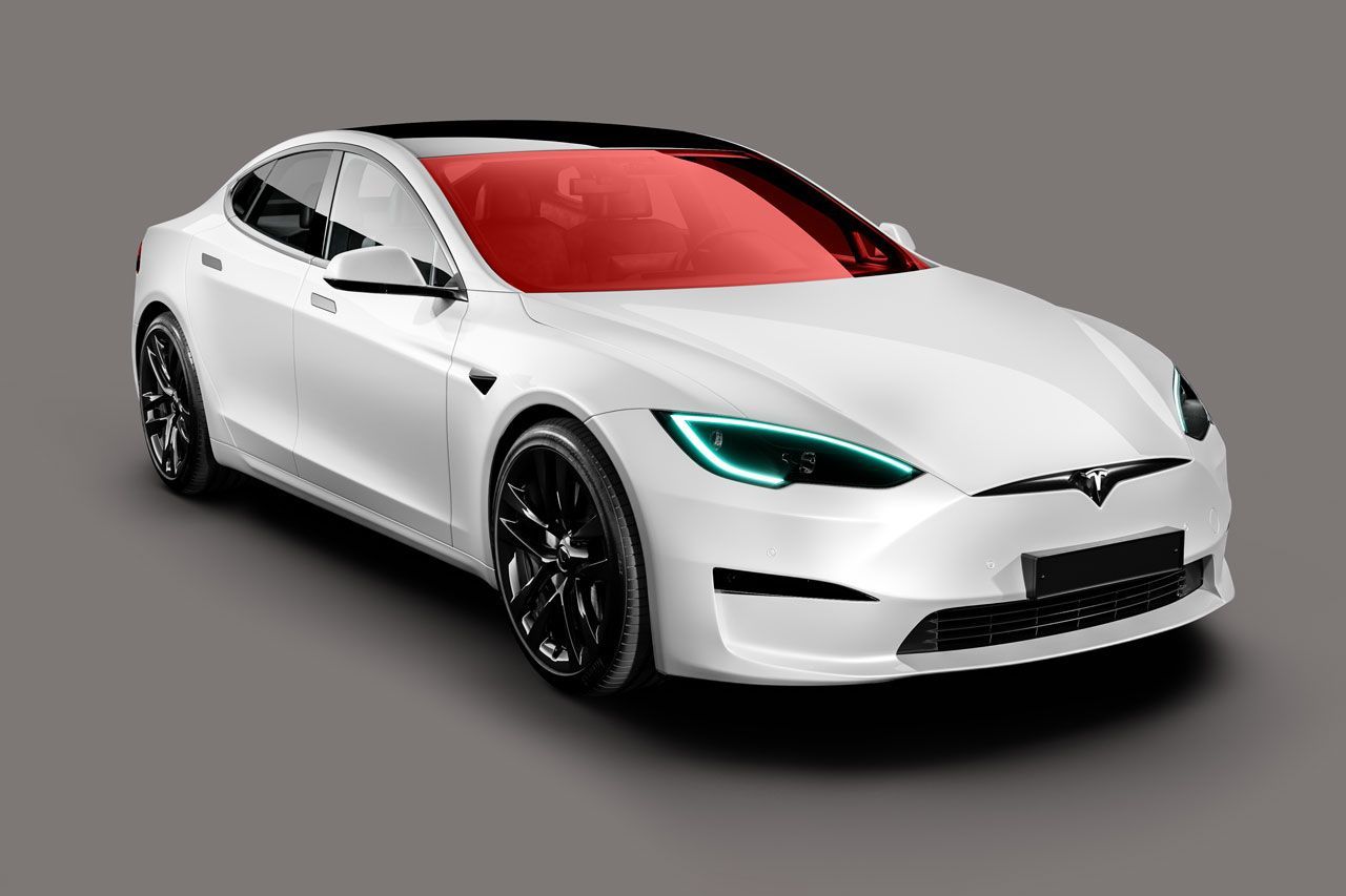 a white tesla model s with a red windshield on a gray background .
