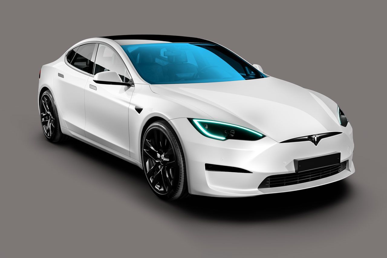 a white tesla model s with a blue windshield on a gray background .