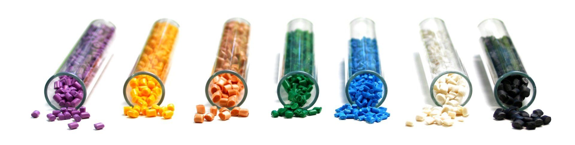 Multicolored plastic granules spilling out of tubes.