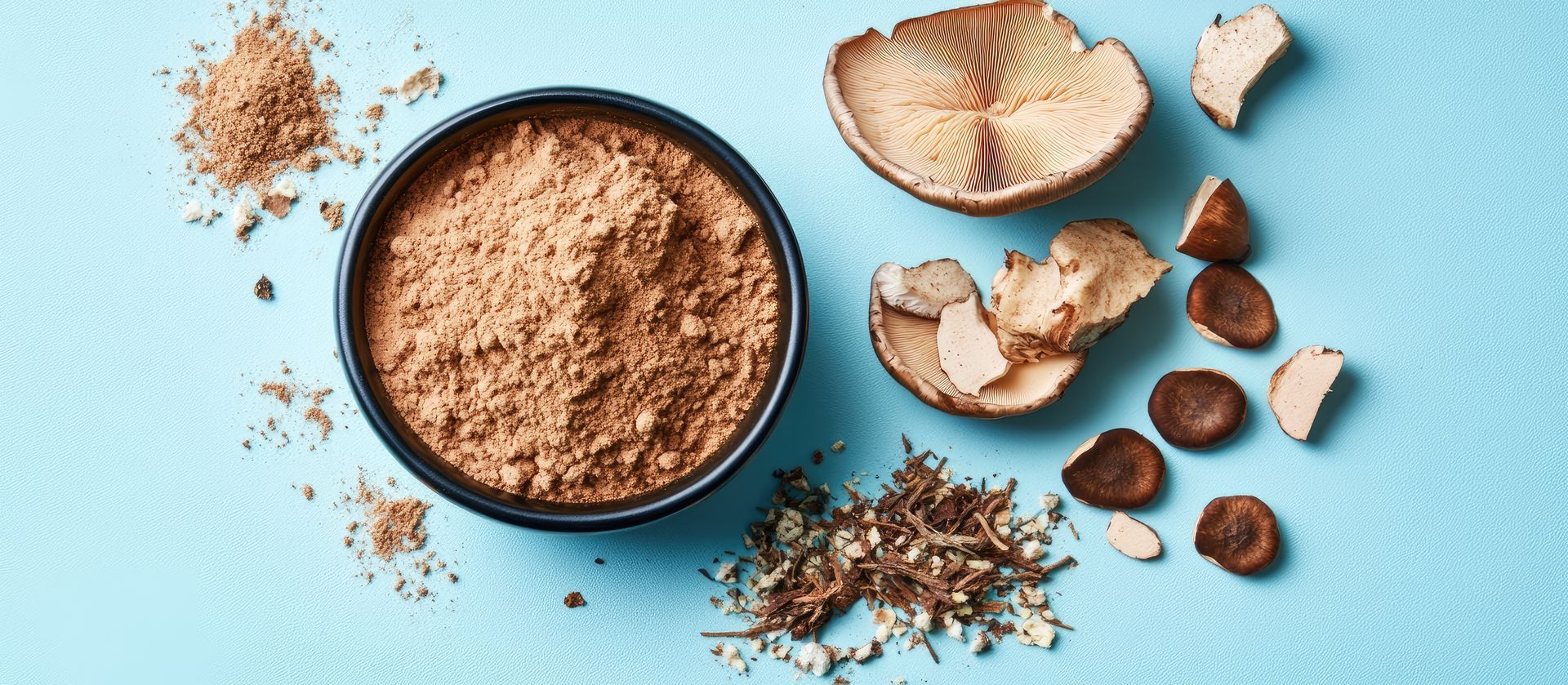 A bowl of powder next to a bowl of dried fruit on a blue surface.